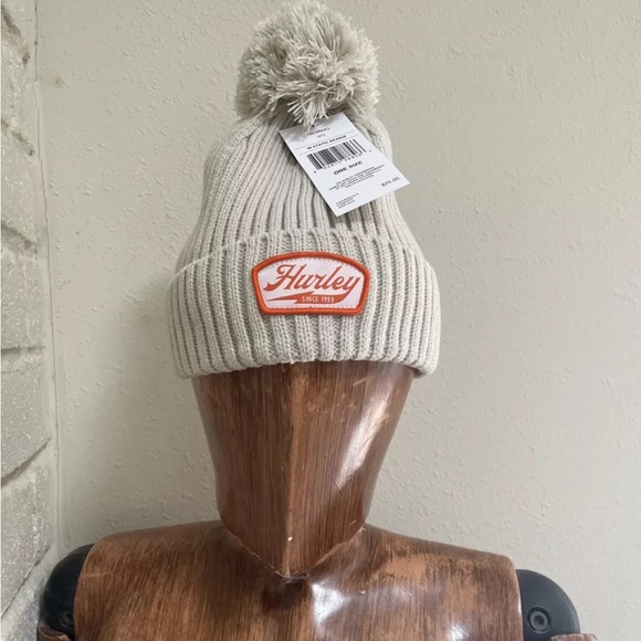 Hurley Static Beanie -Oatmeal- 2 X 2 Rib with‎ cuff & pom pom Orange Logo patch - Picture 1 of 4